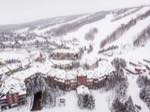 deep winter view of blue mountain village after a fresh snowfall