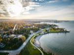 aerial view of sunset point park in collingwood looking toward the downtown core, and the escarpment, as the sun is almost set.